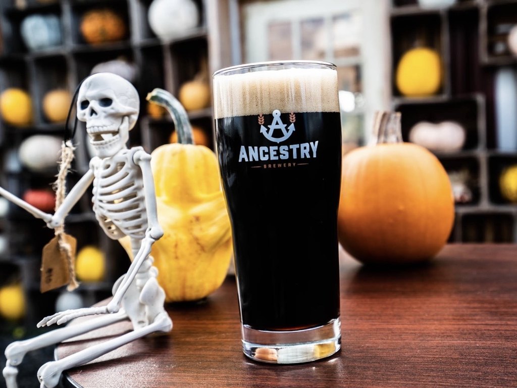 A pint of Pumpkin Porter with pumpkins
